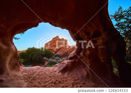 Red Sandstone Cave Babylon Arch Sunlit Desert Landscape Low Angle View Red Sandstone Cave Babylon Arch Sunlit Desert Landscape Low Angle View 126914333