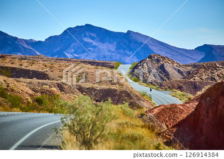 Desert Road Adventure with Motorcyclist Eye-Level Perspective 126914384