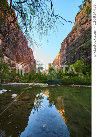 Canyon River Reflection at Golden Hour Low Perspective Canyon River Reflection at Golden Hour Low Perspective 126914419