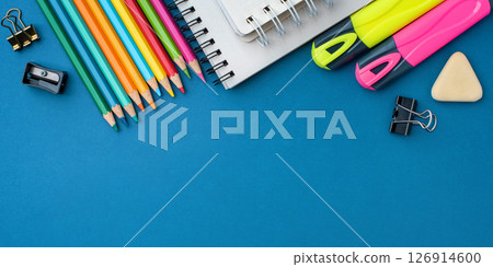 Bright school supplies on a blue background Bright school supplies on a blue background 126914600