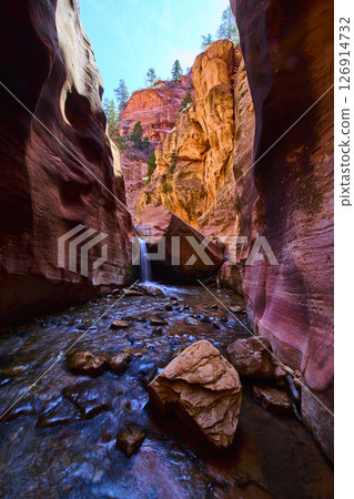 Kanarra Falls Waterfall Motion in Red Rock Slot Canyon Low Angle View 126914732