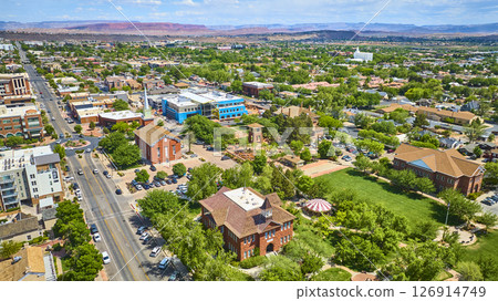 Aerial Downtown St George Red Brick Landmarks and Red Rock Mesas Fly Over 126914749