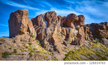 Aerial Fly Through Rugged Desert Rock Formations and Blue Sky Southwest 126914763