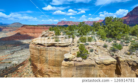 Aerial Fly Over Sandstone Cliffs Juniper Sagebrush and Red Rock Canyon Vista Aerial Fly Over Sandstone Cliffs Juniper Sagebrush and Red Rock Canyon Vista 126914781