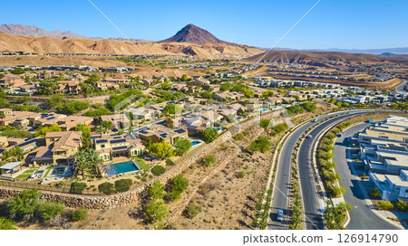 Aerial Suburban Neighborhood with Pools and Desert Mountains Fly Over Aerial Suburban Neighborhood with Pools and Desert Mountains Fly Over 126914790