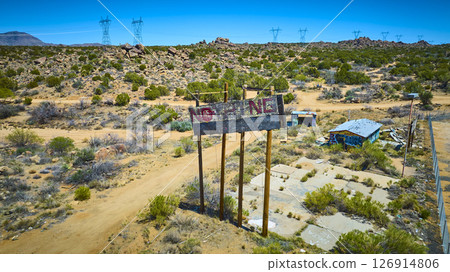 Aerial Abandoned Desert NOTHING Billboard and Graffiti Ruins with Power Lines 126914806