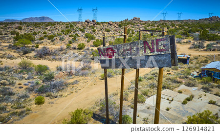 Aerial Abandoned NOTHING Desert Billboard and Graffiti with Power Lines Fly Over Aerial Abandoned NOTHING Desert Billboard and Graffiti with Power Lines Fly Over 126914821