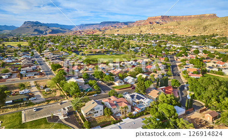 Aerial Suburban Neighborhood and Park with Desert Mesas Fly Over Aerial Suburban Neighborhood and Park with Desert Mesas Fly Over 126914824