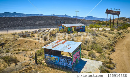 Aerial of Abandoned Graffiti Desert Buildings and NOTHING Signpost Arizona 126914888