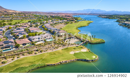 Aerial Luxury Lakeside Golf Community with Modern Homes and Desert Mountains 126914902