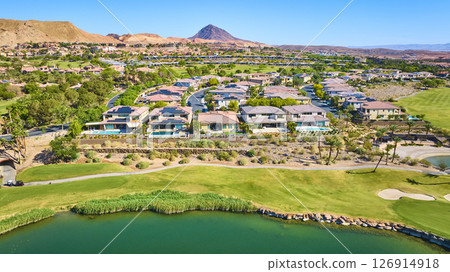 Aerial Luxury Desert Homes Golf Course Lake and Mountains Fly Over 126914918