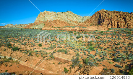 Aerial Fly Over Red Sandstone Cliffs Desert Plain and Rocky Strata in Utah 126914923