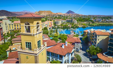 Aerial Mediterranean Village Bell Tower and Lake with Desert Mountains Fly Over Aerial Mediterranean Village Bell Tower and Lake with Desert Mountains Fly Over 126914989