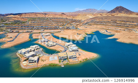Aerial Modern Waterfront Homes and Desert Lake in Suburban Development Fly Over 126914996