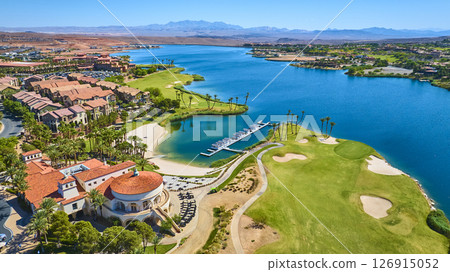 Aerial Luxury Lakeside Resort Golf Course and Marina with Palm Trees Fly Over Aerial Luxury Lakeside Resort Golf Course and Marina with Palm Trees Fly Over 126915052
