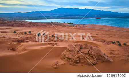 Aerial Fly Over Red Sand Dunes Reservoir and Mountains Sand Hollow State Park 126915092