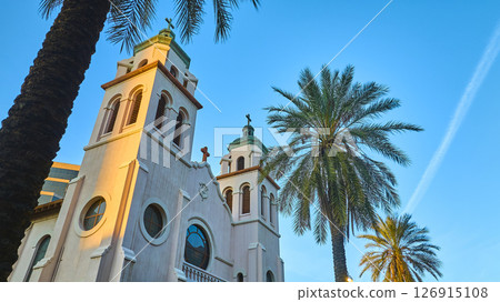 Historic Mediterranean Church and Palm Trees with City Skyline Aerial Tilt 126915108