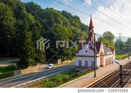 karpaty, zakarpattia/ukraine - jul 28, 2013: old railway station karpaty in morning light. historical building in carpathian mountains in summer. austro-hungarian architecture of transcarpathia 126915268