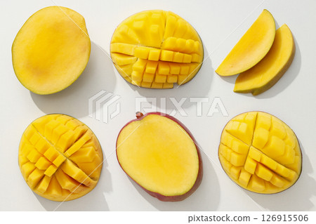 Ripe sliced mango on a white background Ripe sliced mango on a white background 126915506