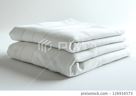 Textiles for Grand hotel. Egyptian cotton sheets on a white background. Stack of high-thread-count white sheets. Textiles for Grand hotel. Egyptian cotton sheets on a white background. Stack of high-thread-count white sheets. 126916573