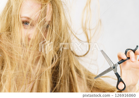 Girl with scissors thinning shears Girl with scissors thinning shears 126916860