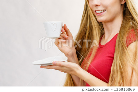 Blonde girl with coffee cup Blonde girl with coffee cup 126916869