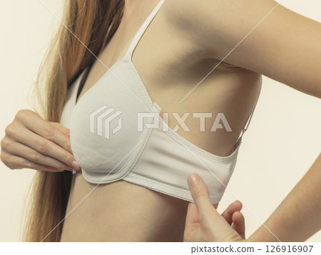 Woman wearing too big bra Woman wearing too big bra 126916907