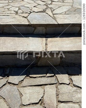 Outdoor staircase made of natural stone. Outdoor staircase made of natural stone. 126916990