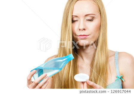 Woman using cleanser cosmetic 126917044