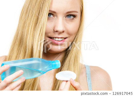 Woman using cleanser cosmetic 126917045