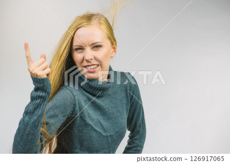 Woman pointing finger displeased 126917065