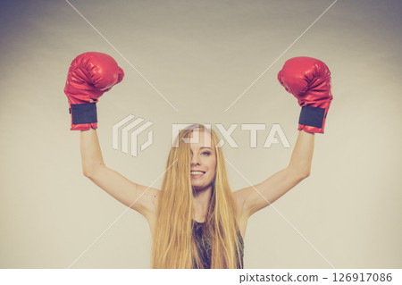 Woman in red gloves with arms up Woman in red gloves with arms up 126917086