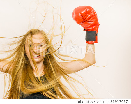 Woman in red gloves with arms up Woman in red gloves with arms up 126917087