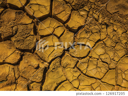 Yellow cracked clay wall 126917205