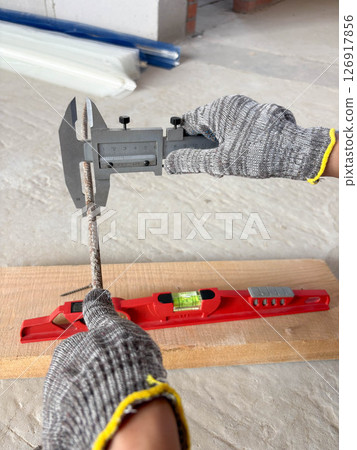 Metal caliper, construction and working measuring tool in the process of measuring the diameter of reinforcement. Metal caliper, construction and working measuring tool in the process of measuring the diameter of reinforcement. 126917856