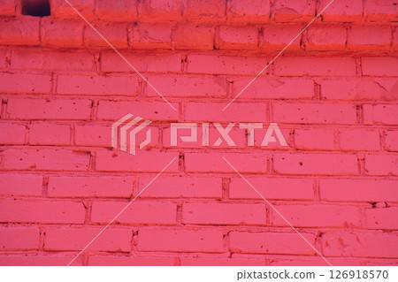 Old red brick wall painted with fresh paint. Brickwork with uneven seams texture  126918570