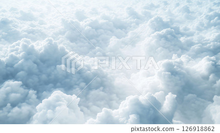 Sunlight filtering through a vast expanse of fluffy white clouds 126918862
