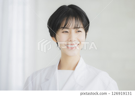 A young lady in white A young lady in white 126919131