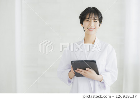 A young lady in white 126919137