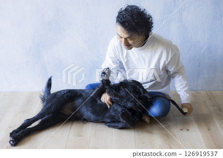 Man relaxing with his dog 126919537