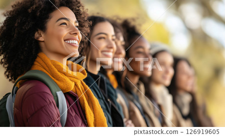 Group of students smiling and looking up in a row outdoors 126919605