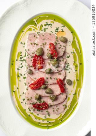 Portion of vitello tonnato appetizer with roast beef Portion of vitello tonnato appetizer with roast beef 126919834