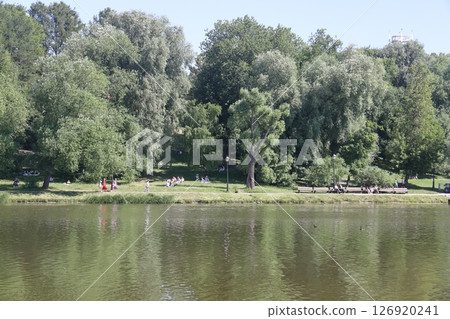 View of the pond and Tsaritsynsky park on a sunny summer day, Moscow, Russia, July 2022. View of the pond and Tsaritsynsky park on a sunny summer day, Moscow, Russia, July 2022. 126920241