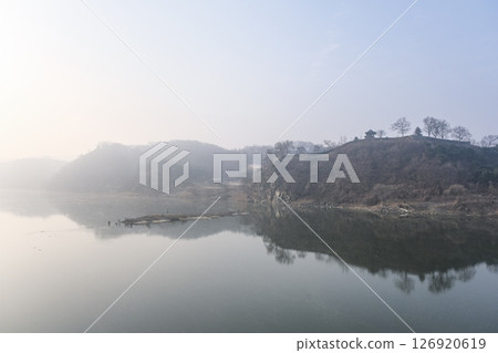 Gongsanseong Fortress, a World Heritage Site, shrouded in morning mist as seen from Kinko Bridge 126920619