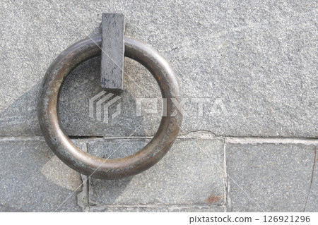 The metal ring in the granite wall symbolizes the chains of non-freedom. 126921296