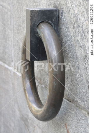 The metal ring in the granite wall symbolizes the chains of non-freedom. 126921298