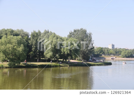 View of the pond and Tsaritsynsky park on a sunny summer day, Moscow, Russia, July 2022. 126921364
