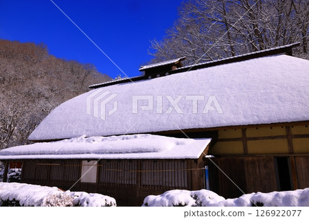 Snow-covered thatched roof village 126922077
