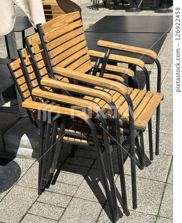 Wooden chairs stack on the street Wooden chairs stack on the street 126922458