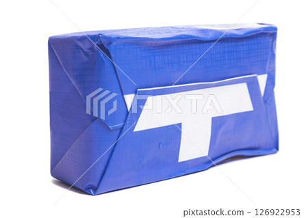 Stick of wrapped butter isolated on white background. 126922953